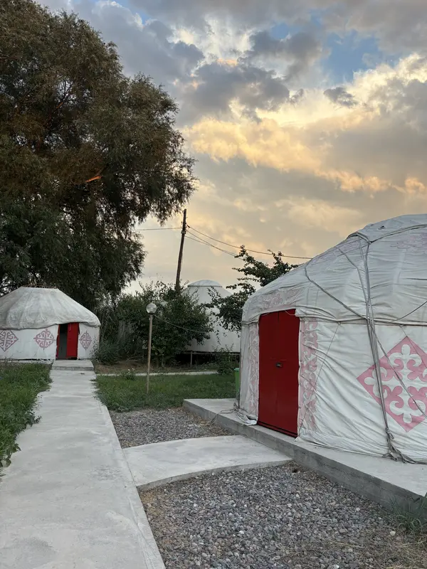 Yurts under clouds